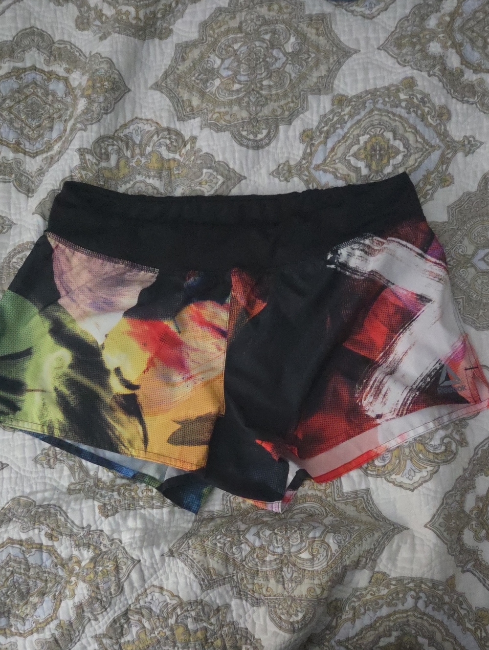 Reebok Women's Black Athletic Shorts with Multicolor Paint-Print